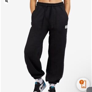 Jordan women’s flight fleece pants size XS Black Joggers with Red Logo.
